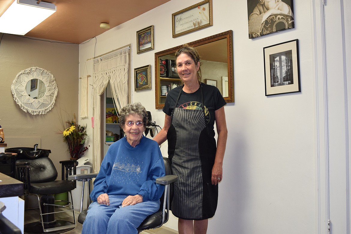 Hair Masters Salon & Spa owner Sina Long, who is named after her grandmother, stops for a photo with longtime client Jane Klasen. Klasen has known Long since she was a little girl and is one example of how important relationships are to the salon owner, she said.