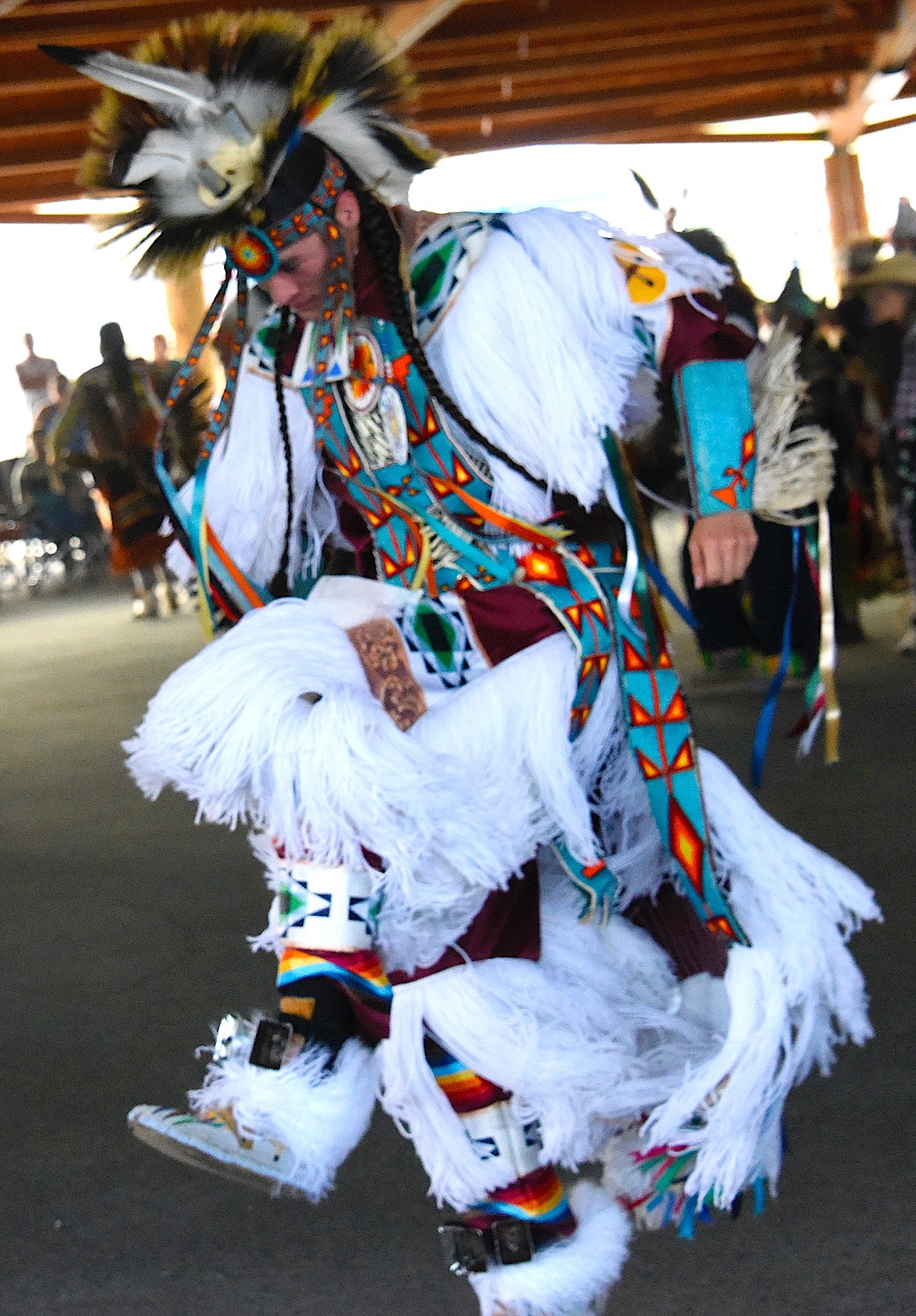 A grass dancer with amazing regalia dances in the grand entry at the Standing Arrow Powwow. (Berl Tiskus/Leader)
