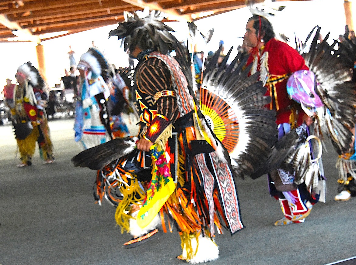 The first 2023 Standing Arrow Powwow grand entry began at 7 p.m. on Friday with men dancers entering the pavilion first. (Berl Tiskus/Leader)