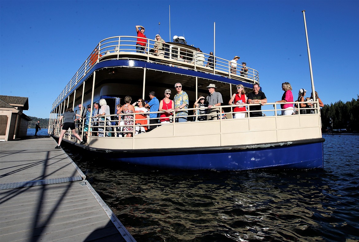 Those attending the "Finish the Journey" fundraiser for Companions Animal Center at Hagadone Gardens at Casco Bay arrive by Lake Coeur d'Alene Cruises on Tuesday.