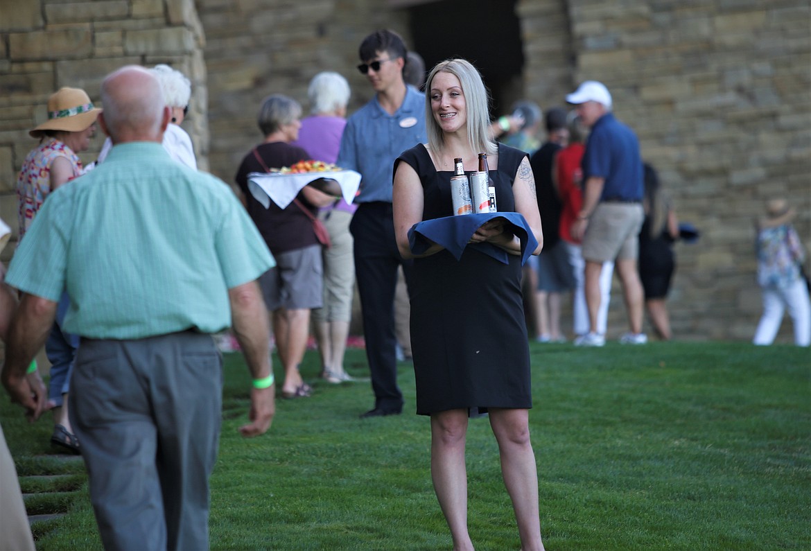 A server greets guests at Hagadone Gardens at Casco Bay on Tuesday.