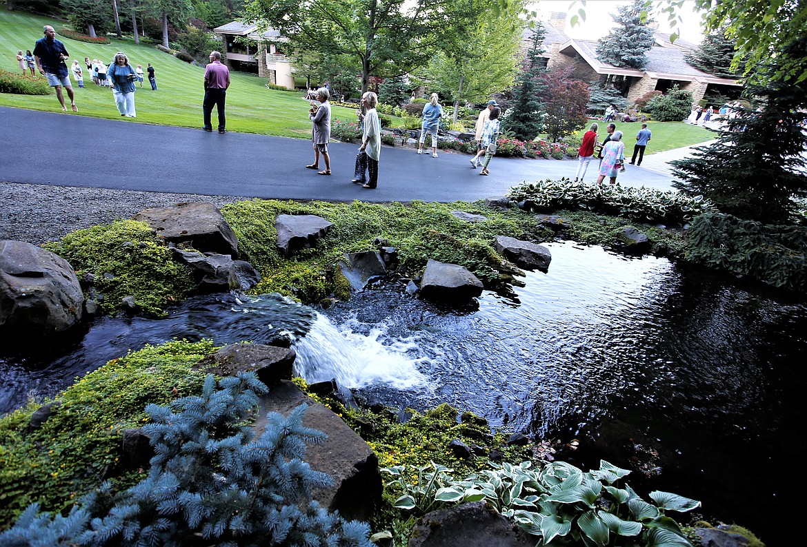 Guest walk the grounds of Hagadone Gardens on Tuesday.