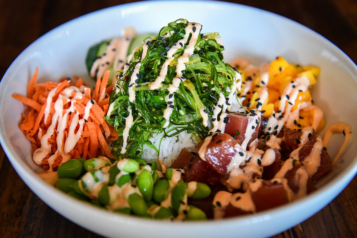 The Ahi Poke Bowl featuring ahi tuna, ponzu, jasmine rice, carrott, cucumber, seaweed salad, sesame seeds, spicy aioli and mango at Sacred Eats inside Sacred Waters Brewing Company on Wednesday, July 19. (Casey Kreider/Daily Inter Lake)