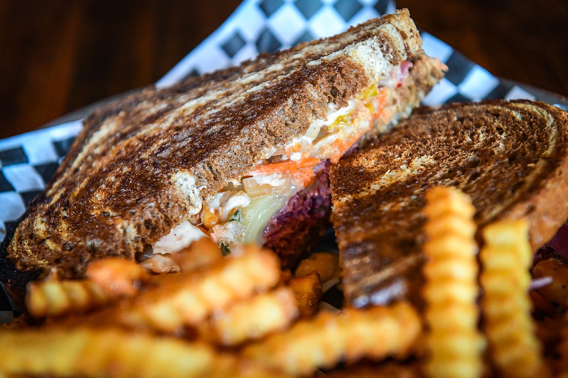 The Kimchi Reuben featuring thin-sliced corned beef, house kimchi, Swiss cheese, spicy aioli and marbled rye bread at Sacred Eats inside Sacred Waters Brewing Company on Wednesday, July 19. (Casey Kreider/Daily Inter Lake)