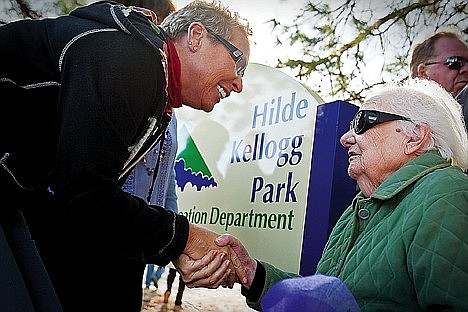 Linda Wilhelm congratulates Hilde Kellogg at the dedication of a park in Hilde’s honor.