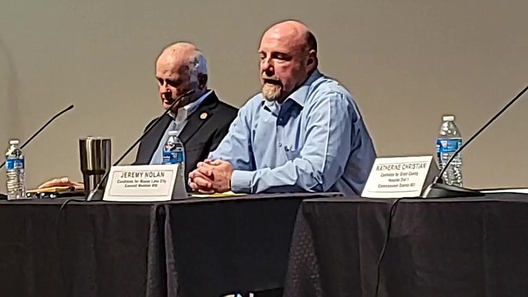 Moses Lake City Council candidates David Eck, left, and Jeremy Nolan, right, discuss city problems and possible solutions during a candidate forum Tuesday sponsored by the Moses Lake Chamber of Commerce.