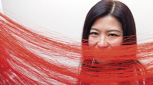 CWU Art + Design Professor Kate Im uses red thread in her work to explore her passion for human connections.