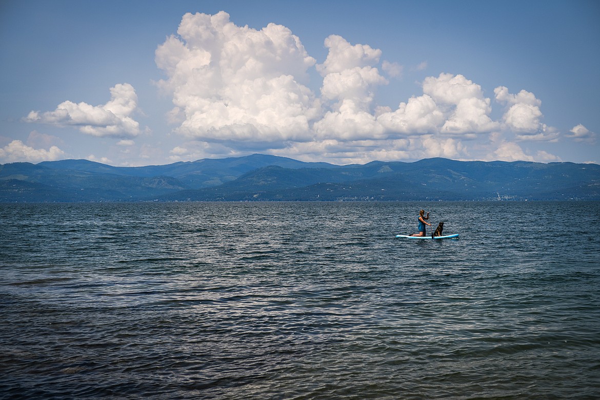 Laurel Sugden paddleboards with her dog Quka at the Wayfarers Unit of Flathead Lake State Park in Bigfork on Wednesday, June 28. (Casey Kreider/Daily Inter Lake)