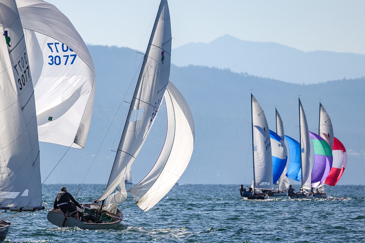 Ben Graham and Jonathon Fetter-Vorm (left) of Somers chase the fleet in the 77th Thistle Nationals on Wednesday, July 19 on Flathead Lake. (JP Edge/Hungry Horse News)