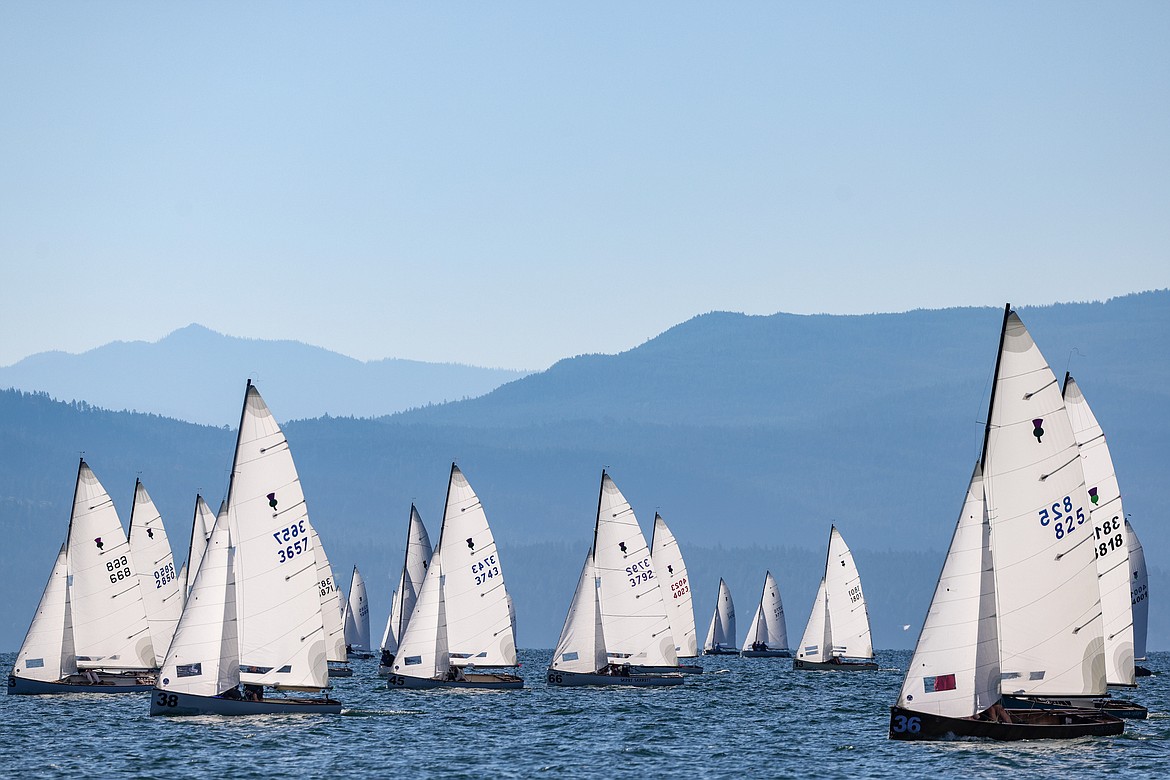 Thistle class sailboats on the third day of the 77th Thistle Nationals on Flathead Lake on Wednesday, July 19. The Thistle is a high-performance one-design racing sailboat that is generally sailed with a three-person crew. The boat is responsive and does well in a wide variety of conditions. (JP Edge photo)