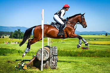 Kaylawna Smith-Cook rides her horse Remember Me over a jump during Novice Three-Day cross-country at The Event at Rebecca Farm on Thursday, July 20. (Casey Kreider/Daily Inter Lake)