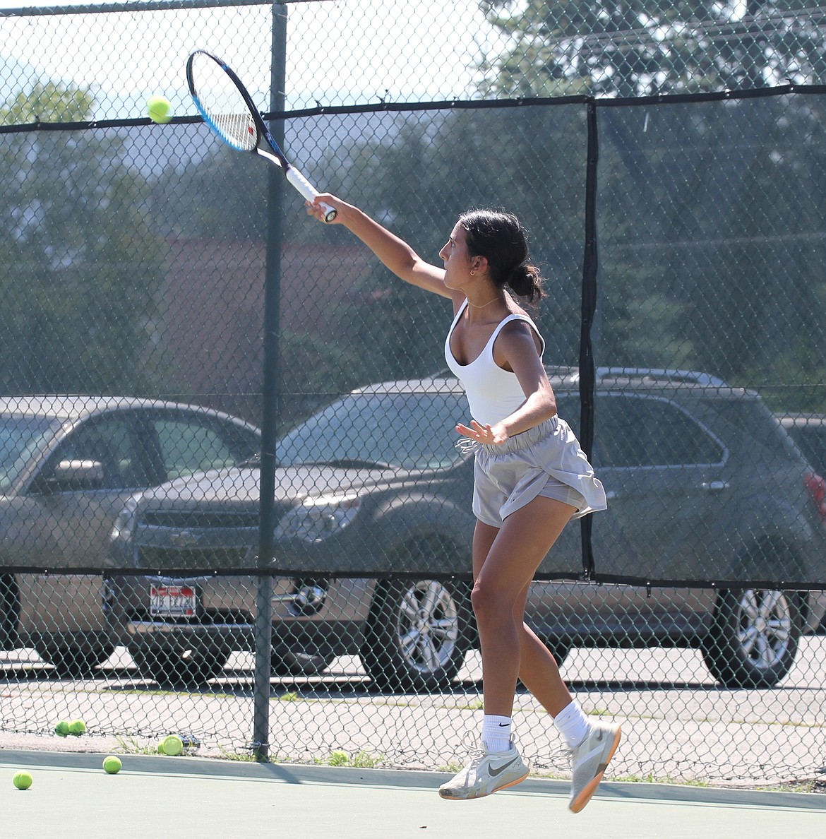 Clark Fork graduate Emily Myers reaches out to return a ball.