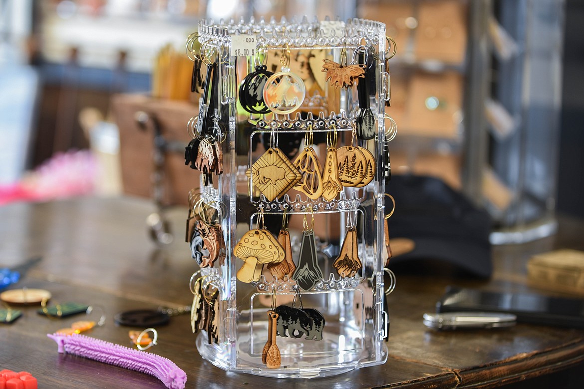 Joe and Lytaunie Burks own Meant to Bee, a local goods shop in Evergreen hoping to inspire local businesses and fundraising efforts. Earrings are one of the store's main goods and are customizable for orders. (Kate Heston/Daily Inter Lake)