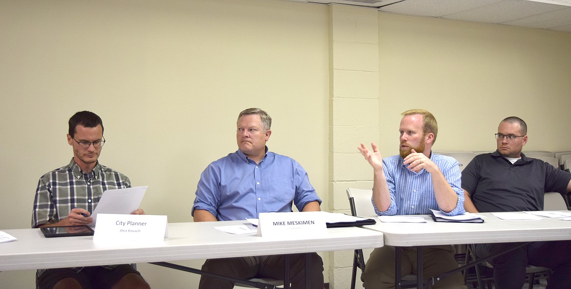 City Engineer Jamin Ankney (middle) speaks during Wednesday’s meeting and explains the emergency funding the city of George secured from the Washington Public Works Board to renovate Well 4 and start design on other well improvements in the city.