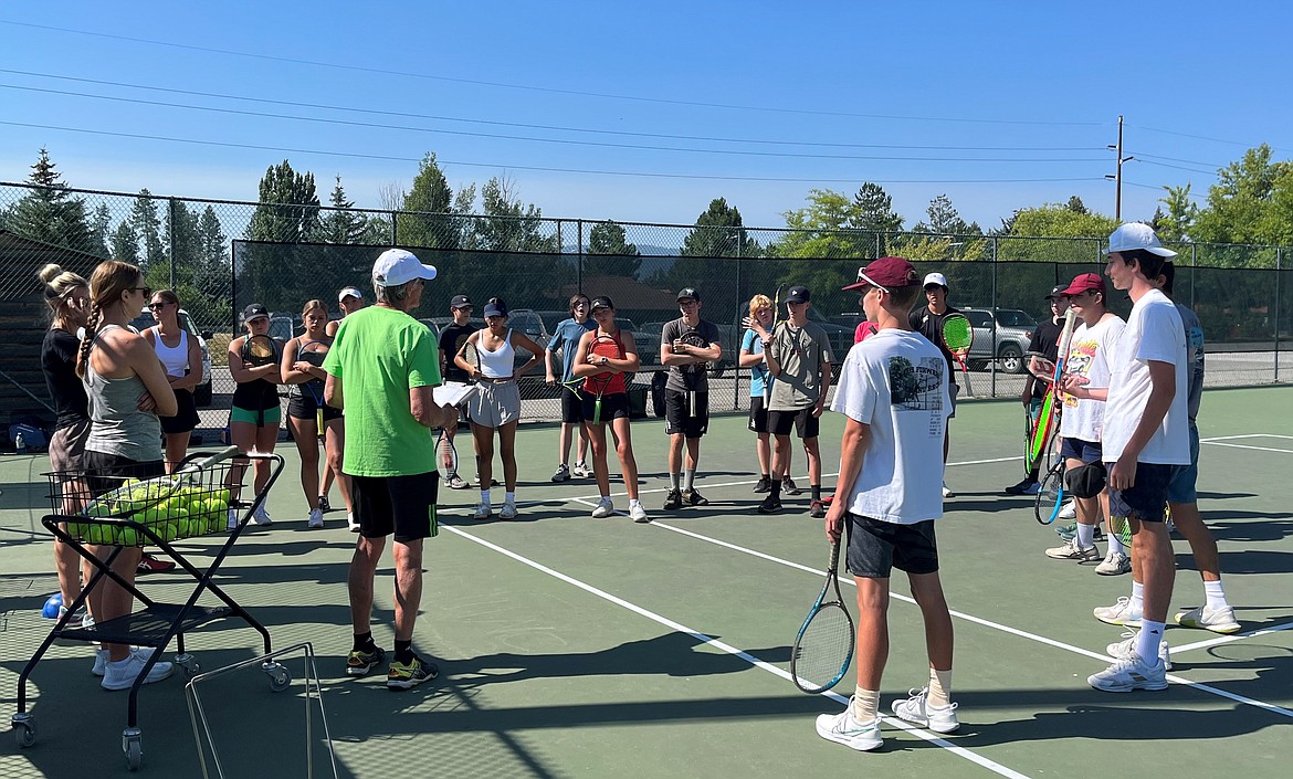 SHS head tennis coach Kent Anderson tells attendees what drills they are to perform first before the start of camp on Thursday.