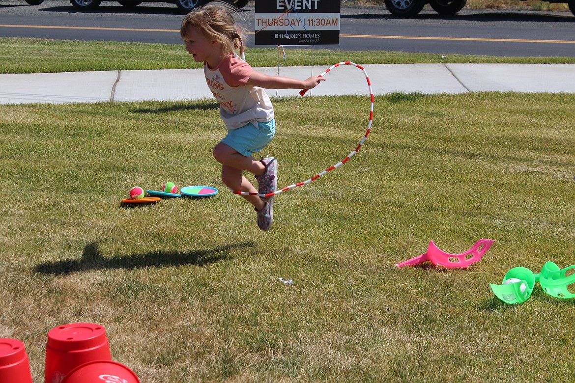 Mary Jones tries out a brand new jump rope at the dedication of Maple Grove Park Thursday.