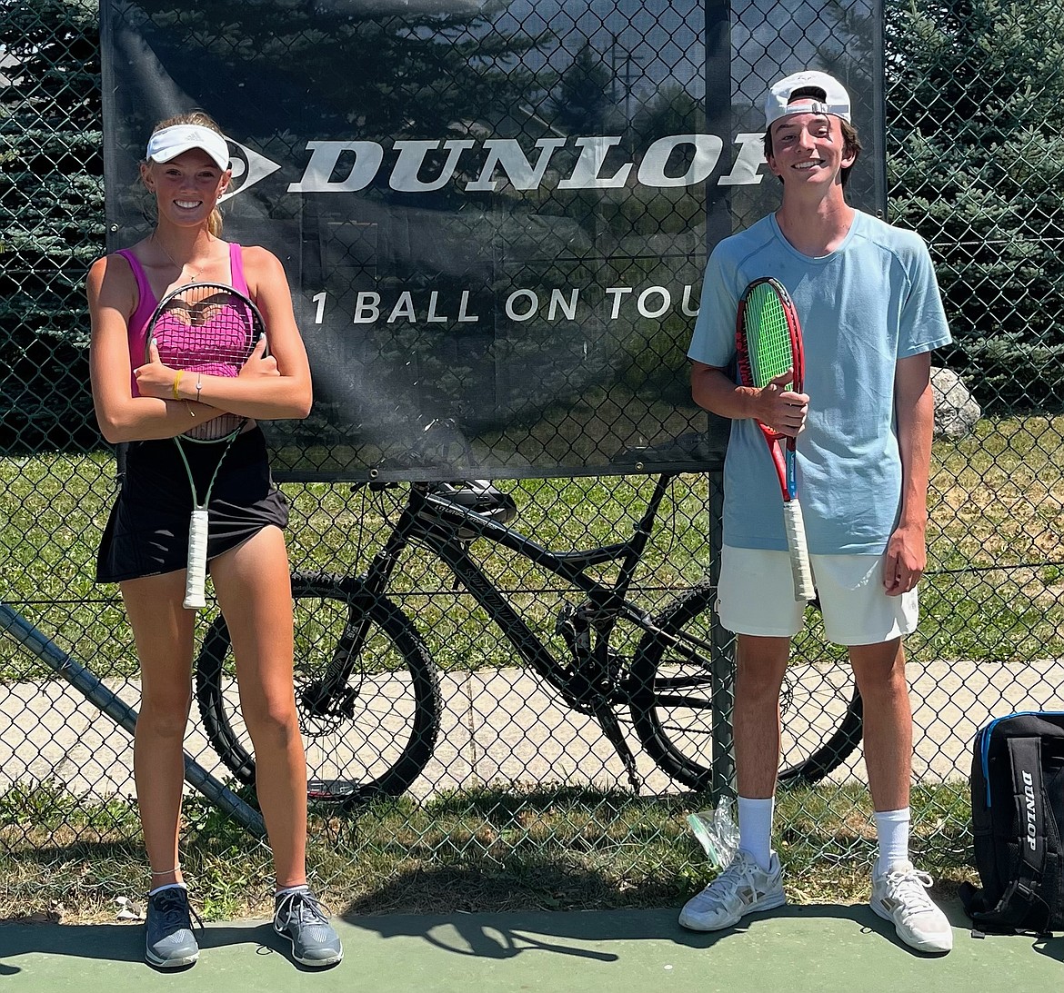 Piper Rickert and Carl Seigel pose for a photo after the hard courts tournament championship match on Wednesday. Rickert defeated Siegel 7-2.