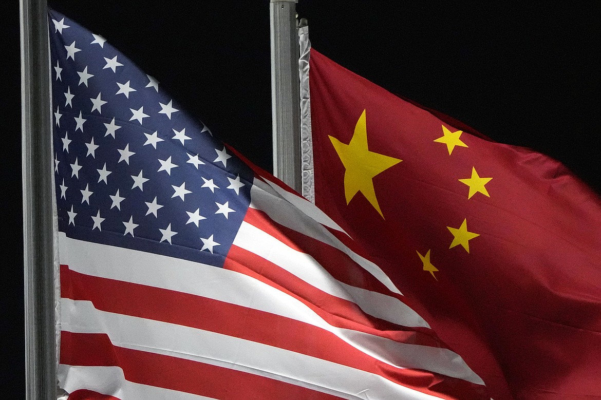 The American and Chinese flags wave at Genting Snow Park ahead of the 2022 Winter Olympics, in Zhangjiakou, China, on Feb. 2, 2022. (AP Photo/Kiichiro Sato, File)