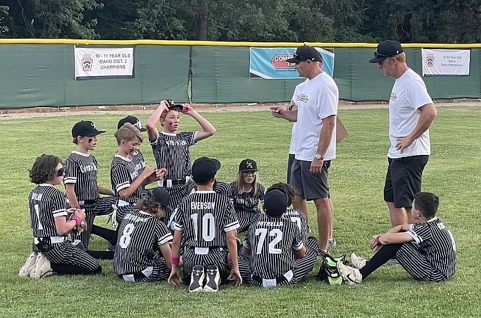 Photo by LAUREN EVERSON
Coeur d'Alene 12U coaches talk to the players after an 8-6 win over North Boise in Game 1 of a best-of-3 series for the state Little League championship Friday in Boise.