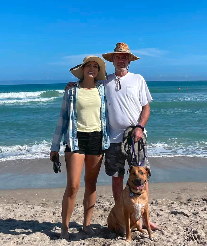 Air Force Tech. Sgt. Nicole McLain is seen here with her dad, Russ McLain of Hayden, and best buddy Chloe on a sunny beach day in Florida around Christmas 2022. Tech. Sgt. McLain, a 2015 Coeur d'Alene Charter Academy graduate, received high praise from the Air Force for her service while stationed at Pope Army Airfield in North Carolina.