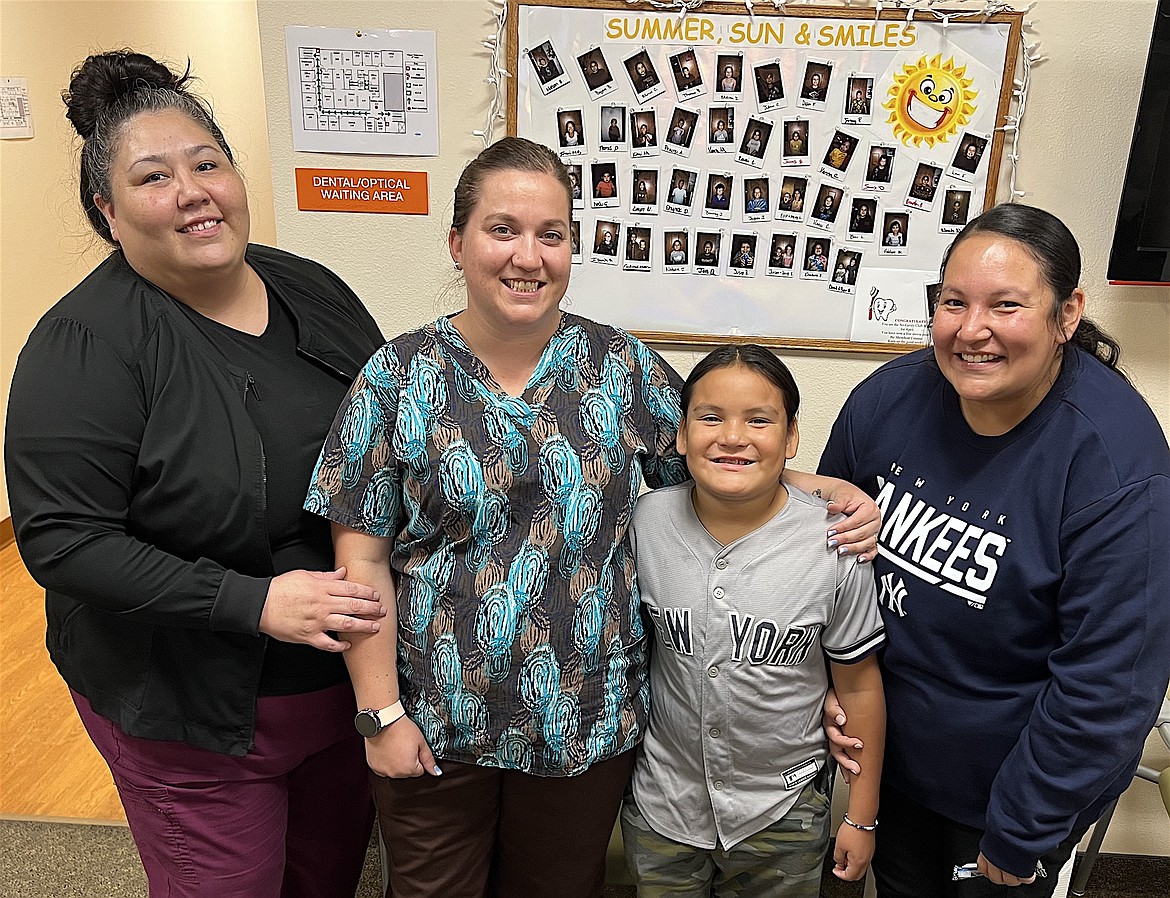 Chaske Ironmaker-Matt celebrates a cavity-free month with (l-r) Felicia Higgins, Monica Christ and Brittany Ironmmaker.