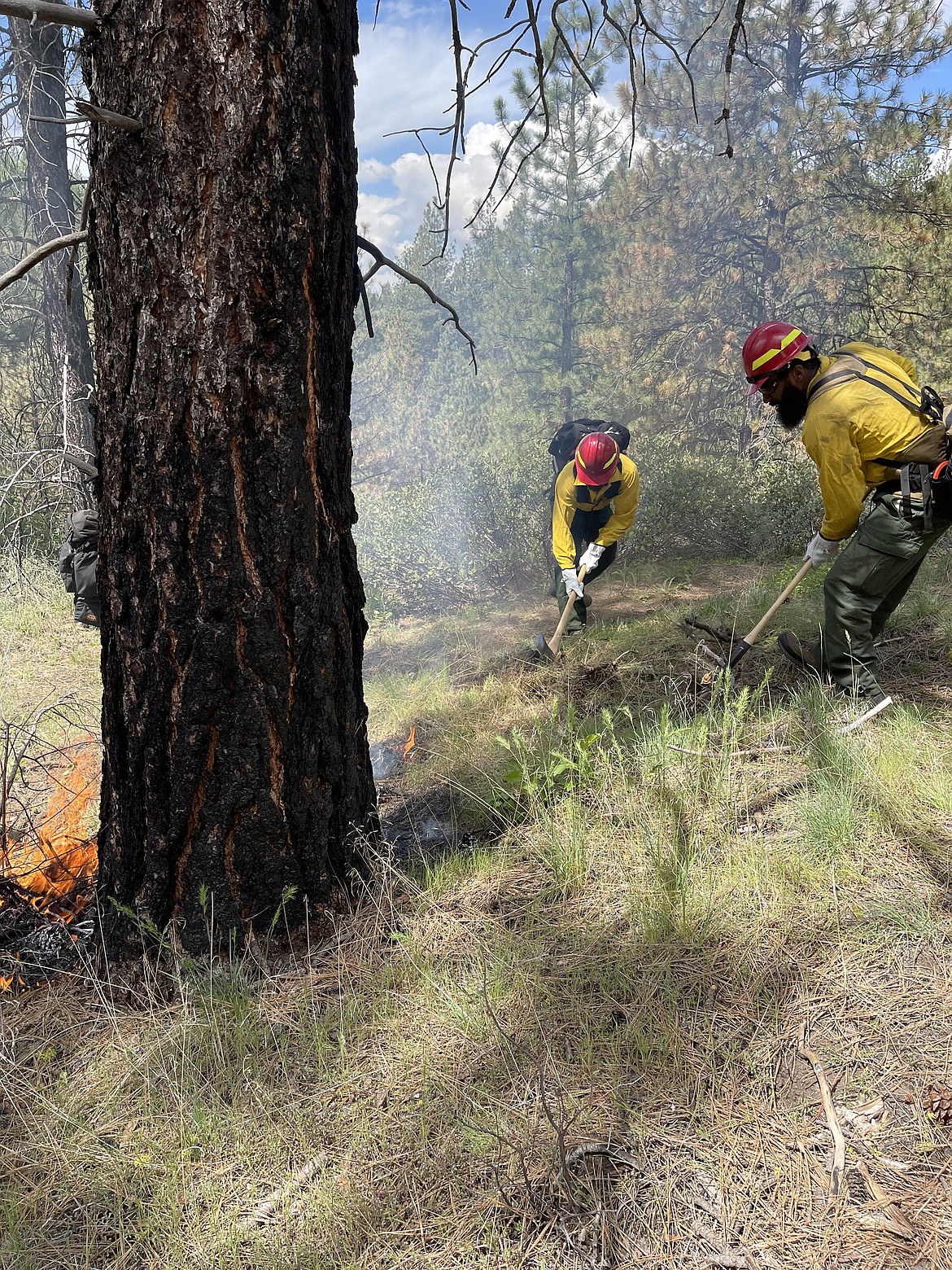 Recruits practice firefighting techniques near Idaho City in May.