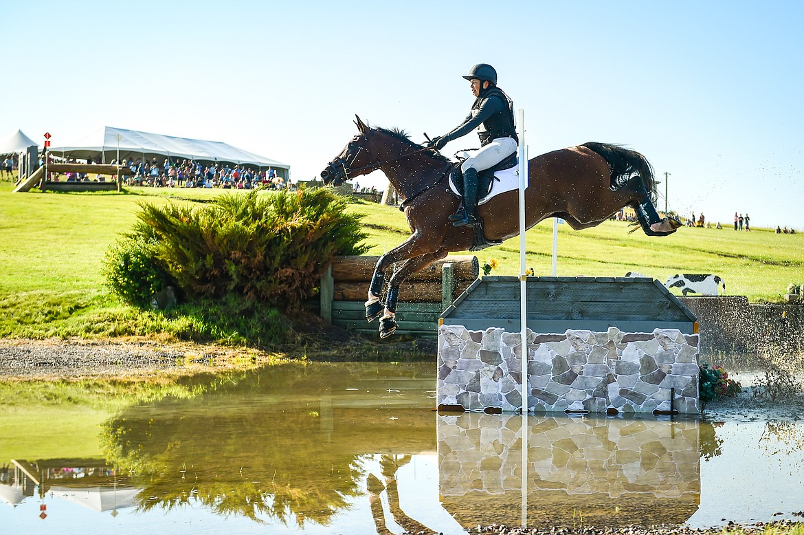 Lucia Strini rides Excel Cool Quality over a jump in a water feature during CCI4*S cross-country at The Event at Rebecca Farm on Saturday, July 22. (Casey Kreider/Daily Inter Lake)