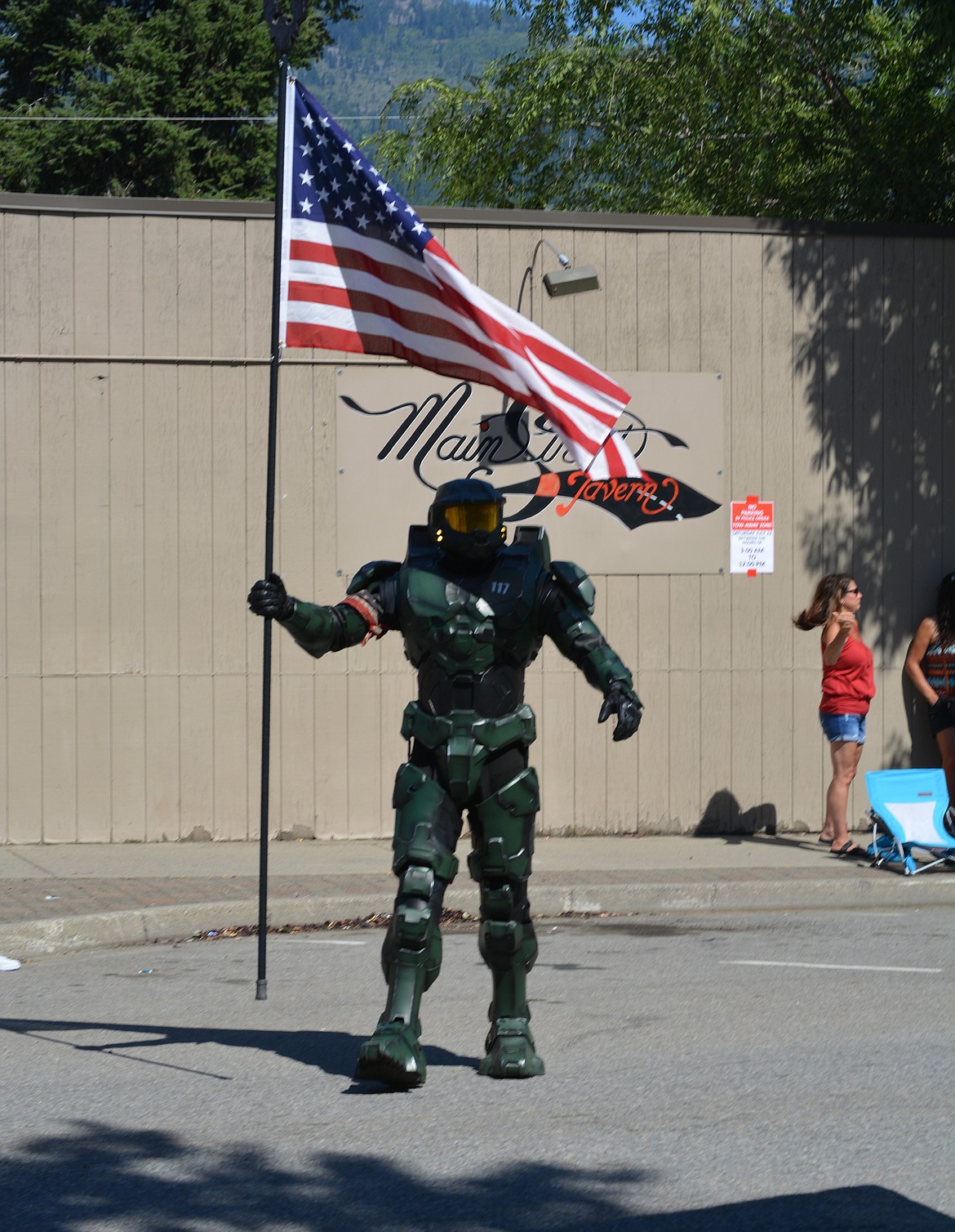 An individual dressed as Master Chief holds the American flag during the Rathdrum Days celebration Saturday.(CAROLYN BOSTICK/Press)