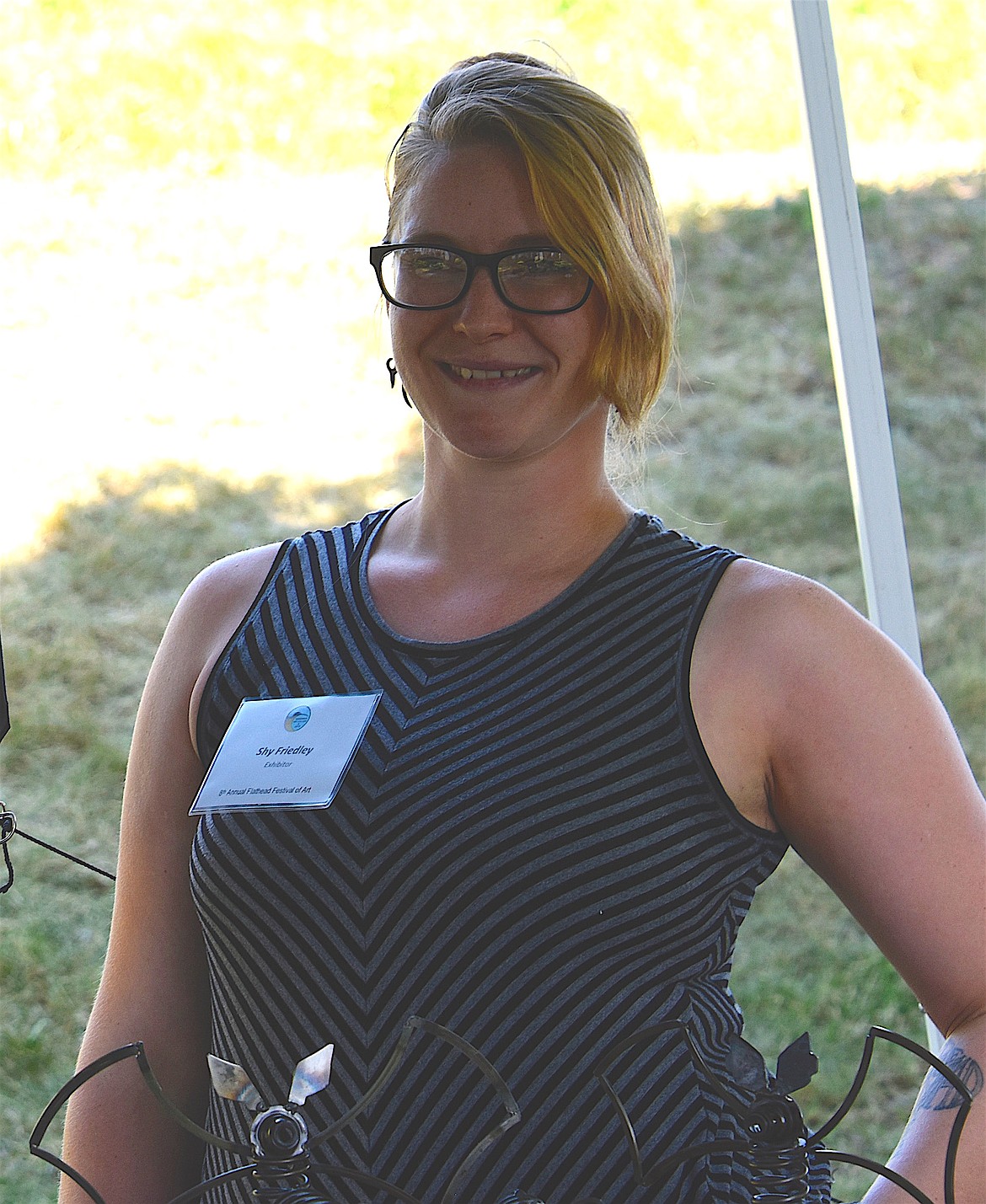 Artist Shy Friedley, Kalispell, brought her Car Part Art to the Flathead Festival of Art. Friedley uses recyclable car parts and broken bicycle chains in her art pieces. (Berl Tiskus/Leader)