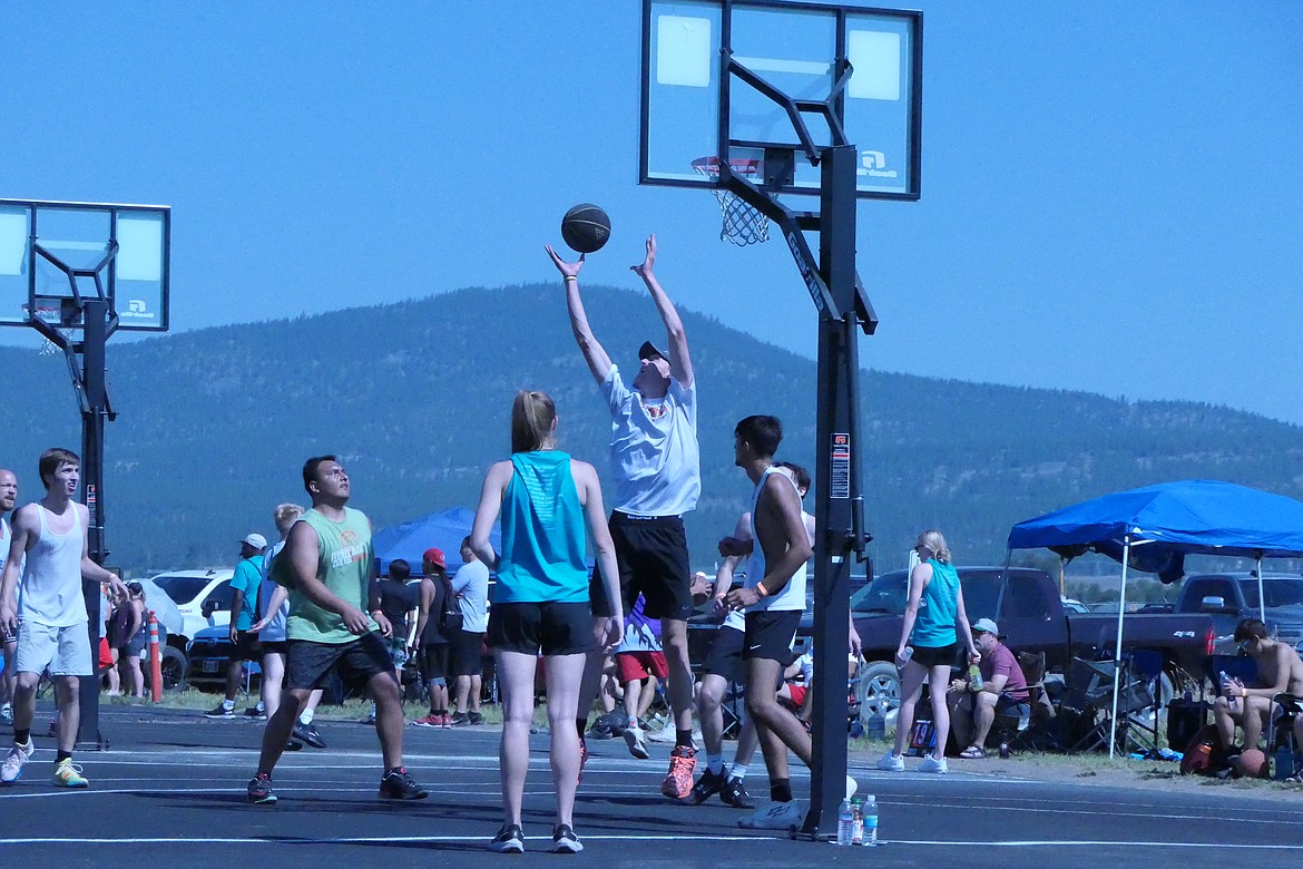 Former Kalispell high school player, 6-10 Erza Epperly snares a rebound during the Open Division play during this past Saturday's 2023 Wild Horse Shootout 3-on-3 basketball event at Amundson Sports Complex in Plains.  (Chuck Bandel/VP-MI)