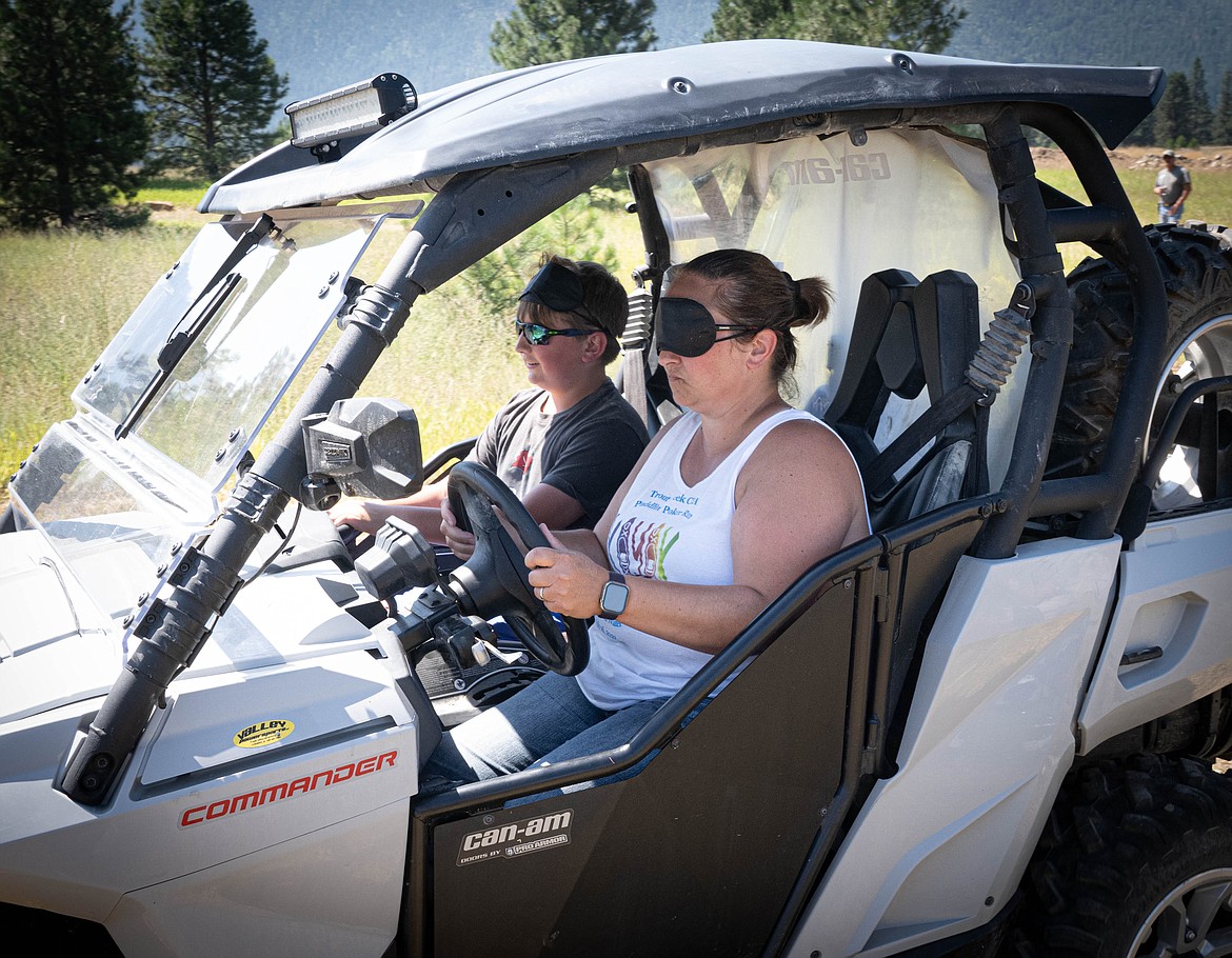 April Phillips and and son Benjamin Grant navigate the course in Thompson Falls. (Tracy Scott/Valley Press)