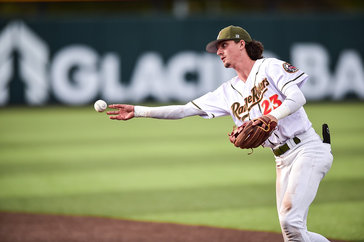 Glacier second baseman Mason Dinesen (23) throws to first after fielding a ground ball in the fourth inning against the Missoula Paddleheads at Glacier Bank Park on Tuesday, July 25. (Casey Kreider/Daily Inter Lake)