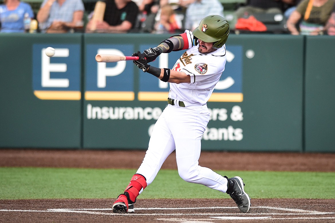 Glacier's Crews Taylor (32) rips a single into the outfield in the first inning against the Missoula Paddleheads at Glacier Bank Park on Tuesday, July 25. (Casey Kreider/Daily Inter Lake)