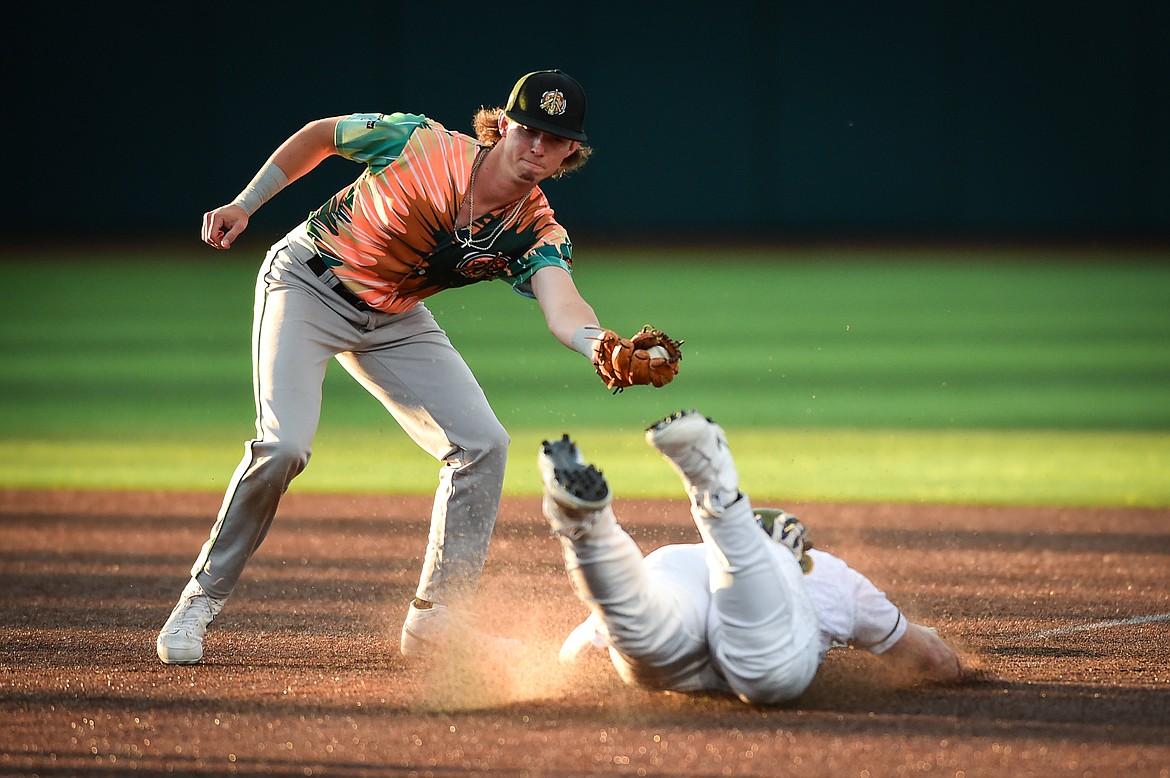 Glacier's Dean Miller (30) steals second ahead of the tag by Missoula second baseman Ryan Cash (7) in the sixth inning at Glacier Bank Park on Tuesday, July 25. (Casey Kreider/Daily Inter Lake)