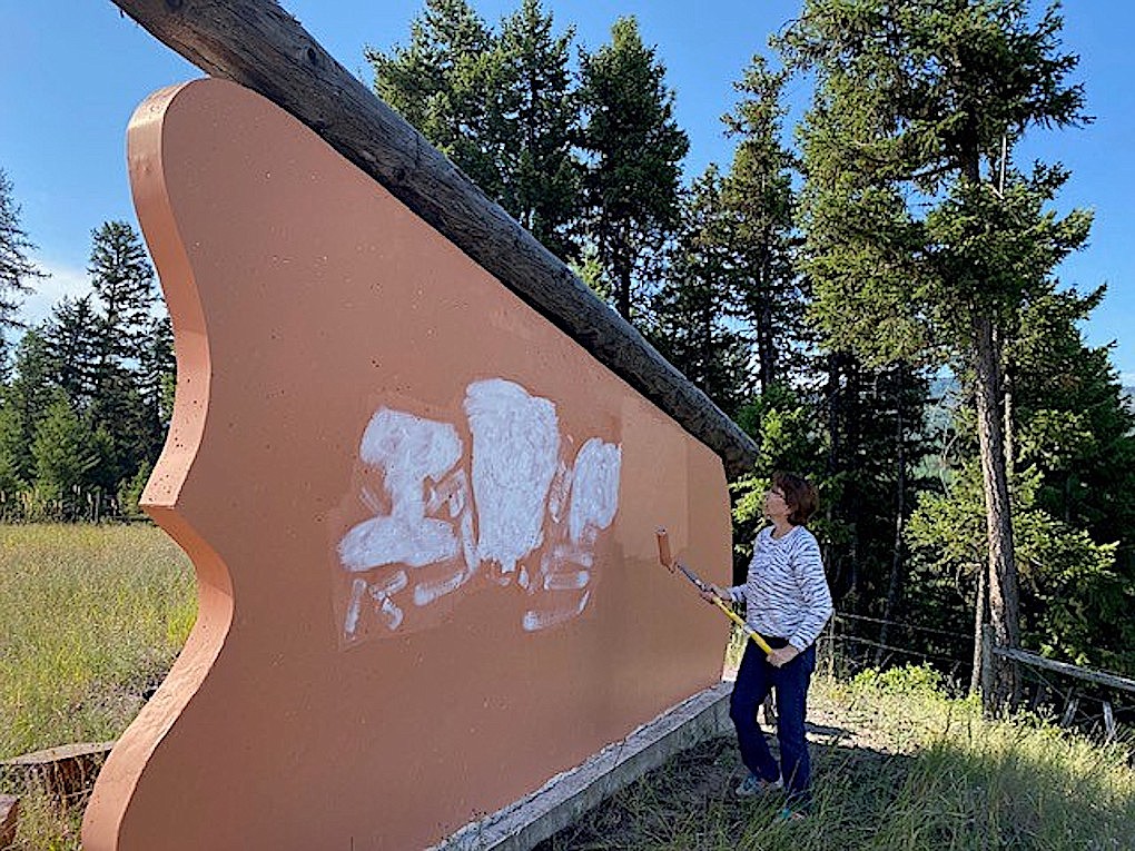 Vandals recently spray painted Lincoln County's "Rich Rare Remote” sign at the county line on U.S. 2, but resident Wendy Chopyak was determined to make sure it didn't remain there long. She, along with Lincoln County Administrative Assistant Jennifer Brown, repainted the sign Monday. (Photo courtesy Jen Brown)