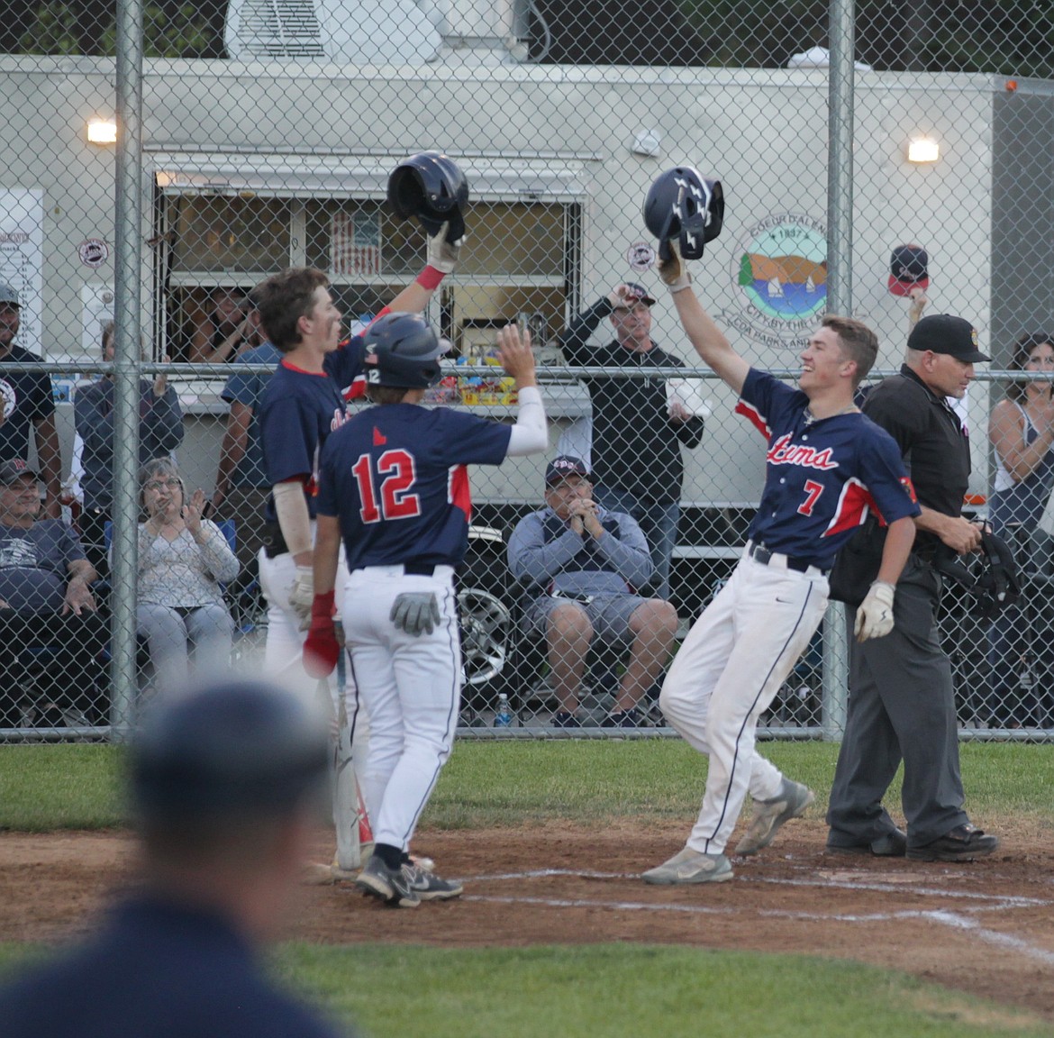 JASON ELLIOTT/Press
Coeur d'Alene outfielder Eric Bumbaugh celebrates with his teammates following his two-run home run in the bottom of the first inning of Tuesday's game against the Nampa Chiefs at Thorco Field.