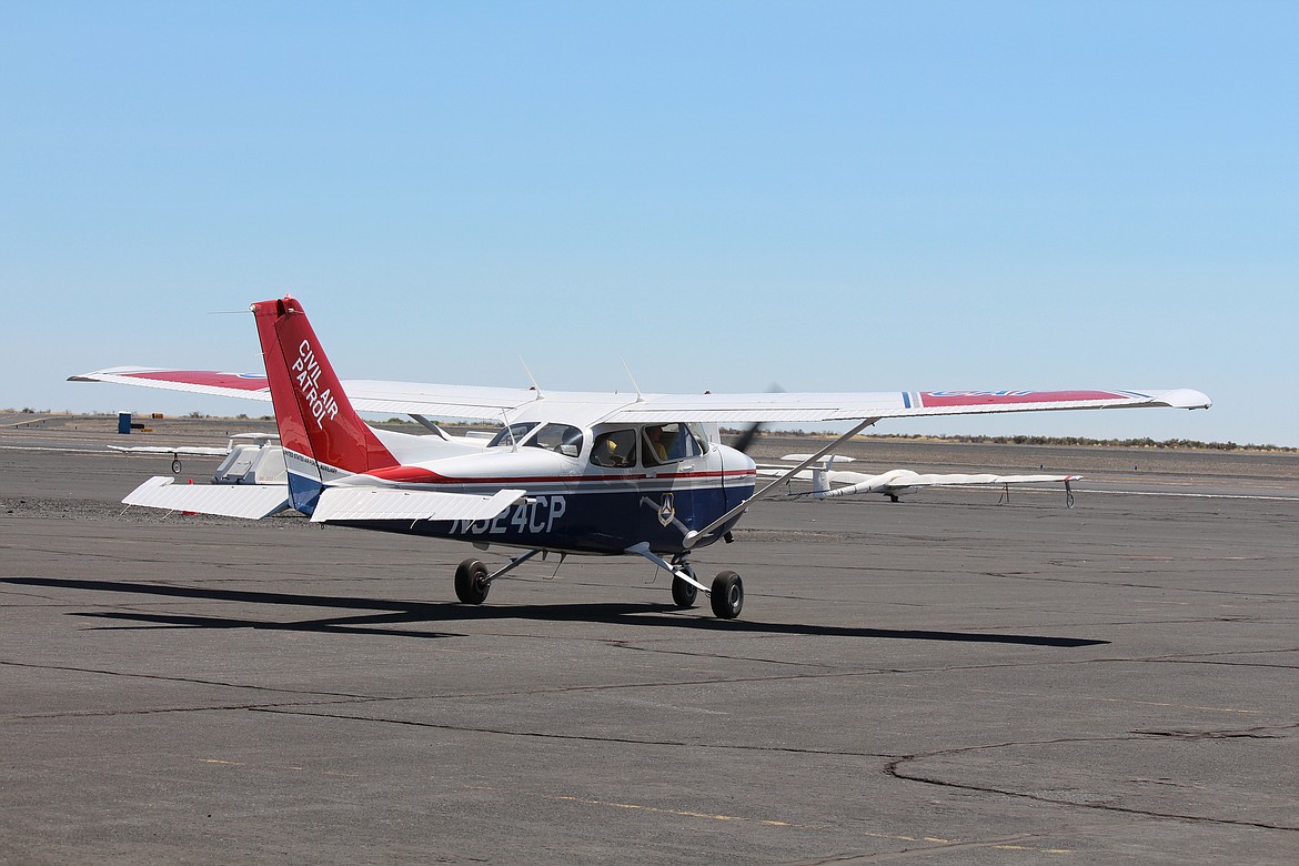 Preflight completedm a student and instructor at the National Flight Academy taxi toward the runway.