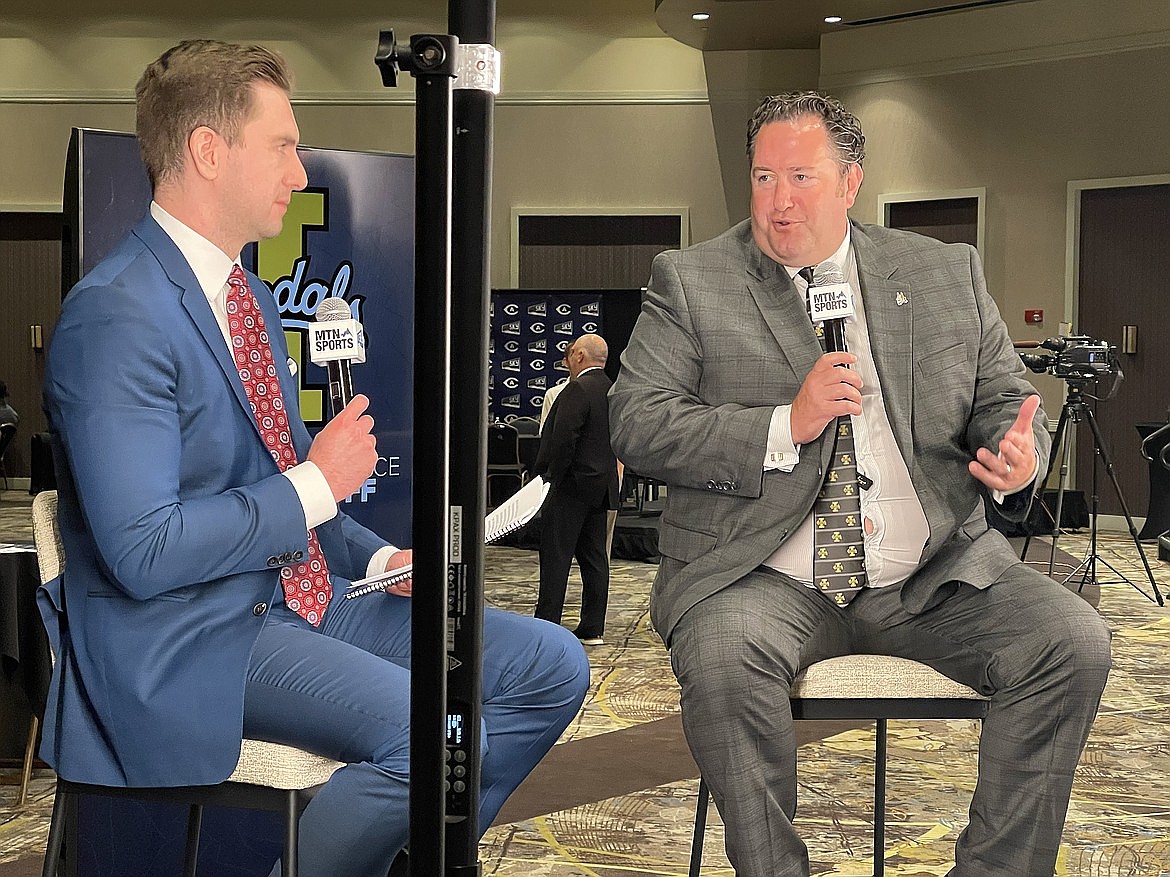 Idaho football coach Jason Eck speaks with a reporter from the Montana Television Network at the Big Sky Football Kickoff on Monday at Northern Quest Resort & Casino in Airway Heights.