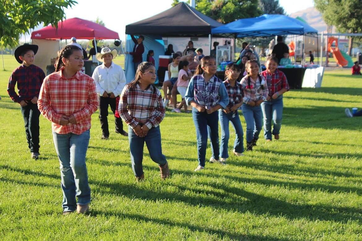 Line dancers demonstrate what they’ve learned during a Mattawa movie night performance.