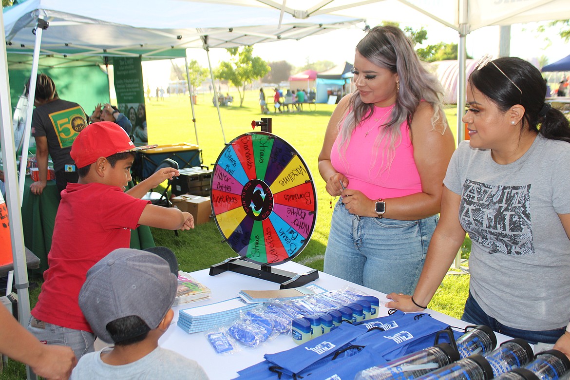 The wheel gets a spin at the Mattawa Community Health Clinic booth at the health fair Friday.