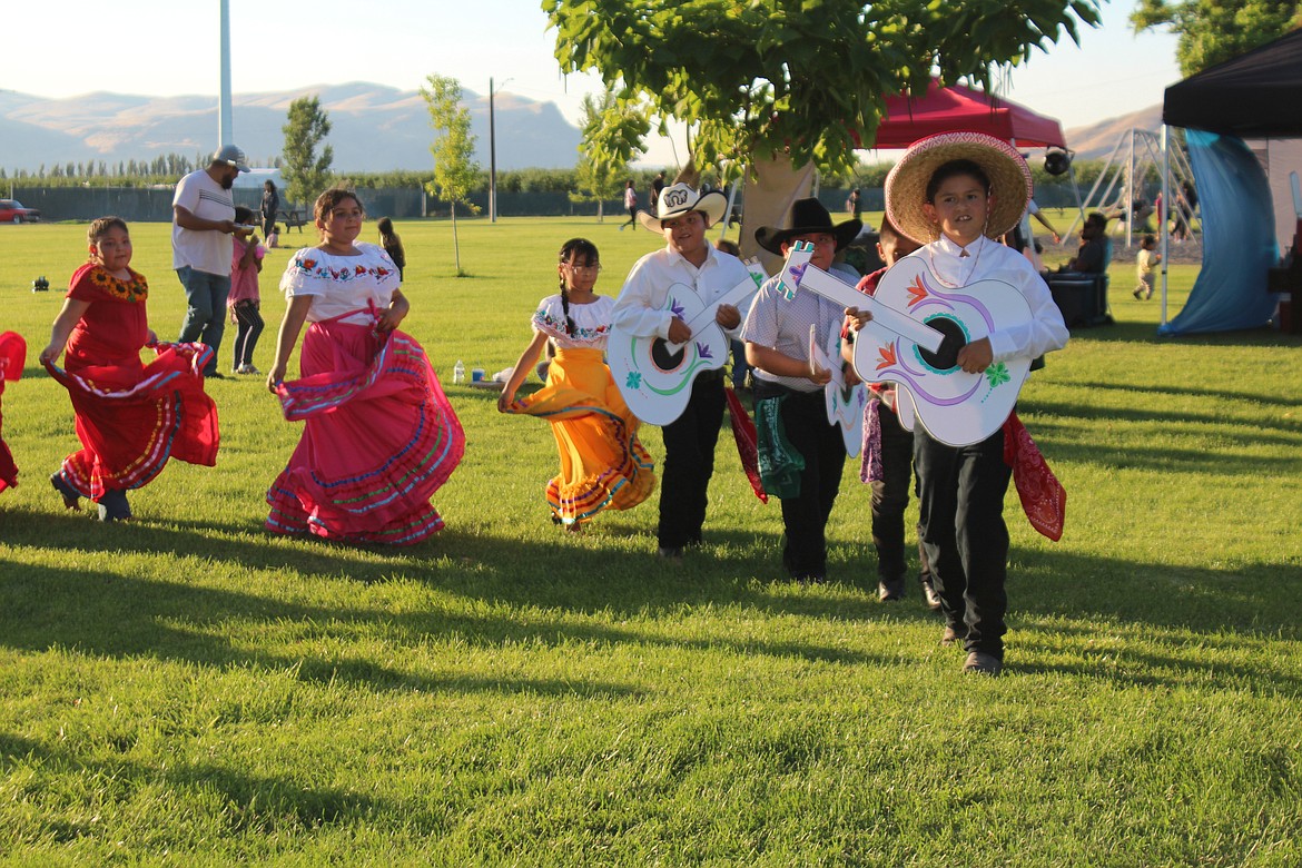 Guitars lead the way during a performance at Mattawa’s summer movie night.