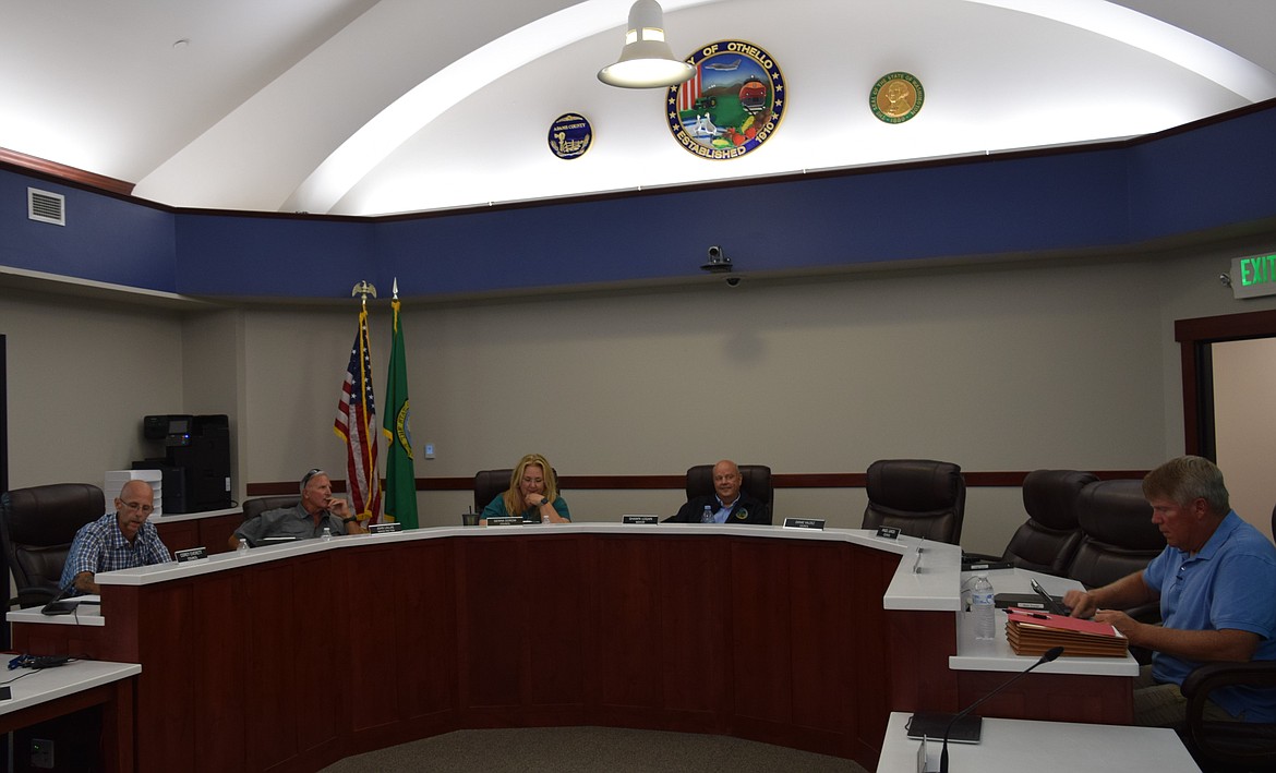 Othello City Council Members Corey Everett, John Lallas, Genna Dorow, Mayor Shawn Logan and Mark Snyder, along with Angel Garza and Jon Erickson, who attended remotely, convene Monday’s meeting in City Hall.