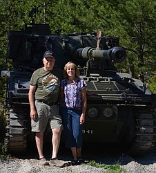 Julia and Jim Hossack fix up demilitarized vehicles and bring them as attractions to local parades. Their British FV433 Abbot 105 mm self-propelled gun rode in the Rathdrum Days Parade. (CAROLYN BOSTICK/Press)