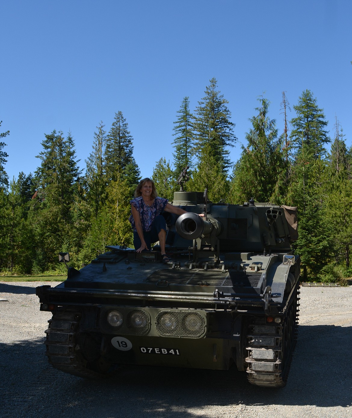 Julia Hossack gets out of the driver's seat of the self-propelled gun that she owns with her husband, Jim Hossack. The couple recently made an appearance with the vehicle at the Rathdrum Days Parade. (CAROLYN BOSTICK/Press)