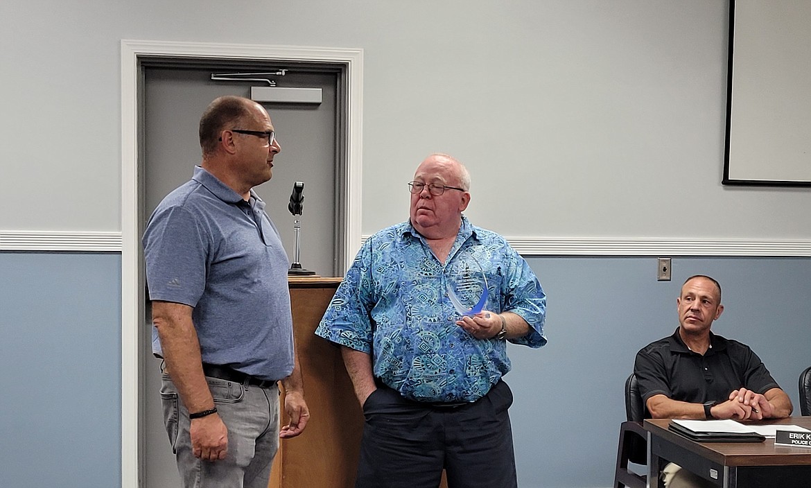 Ephrata Mayor Bruce Reim, right, presents an appreciation award to former Interim City Administrator Kurt Adkinson, left. Adkinson has served the city as police chief and administrator after former service in the Washington State Patrol. He leaves the administrator position as newly-hired City Administrator Ray Towry takes the reins of the city under the supervision of the Ephrata City Council.