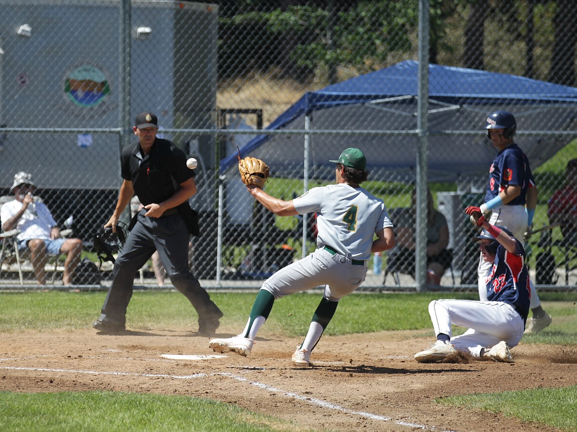 JASON ELLIOTT/Press
Coeur d'Alene Lumbermen baserunner Owen Benson slides under the tag of Lewis-Clark pitcher Sam Lindsley during the second inning of Wednesday's state AA American Legion baseball tournament game at Thorco Field.