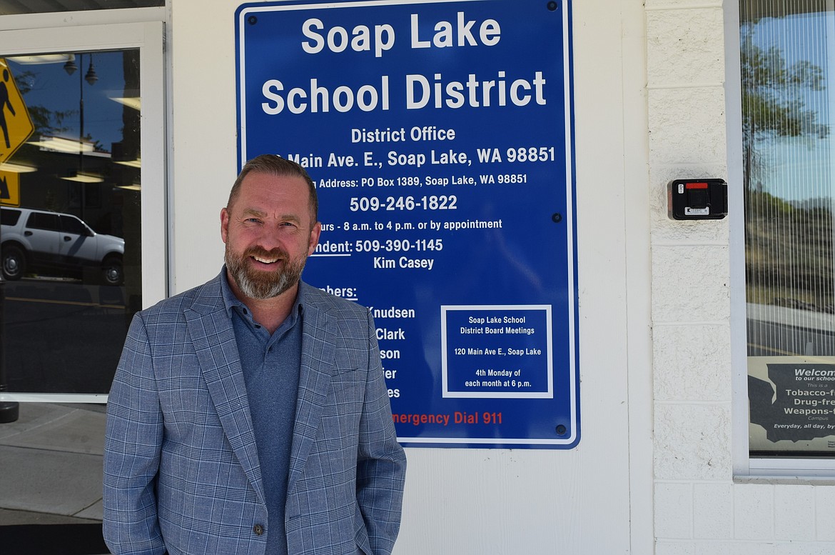 Soap Lake School District’s new superintendent Aaron Chavez stands in front of the district office, where he and district staff are preparing for the upcoming school year.