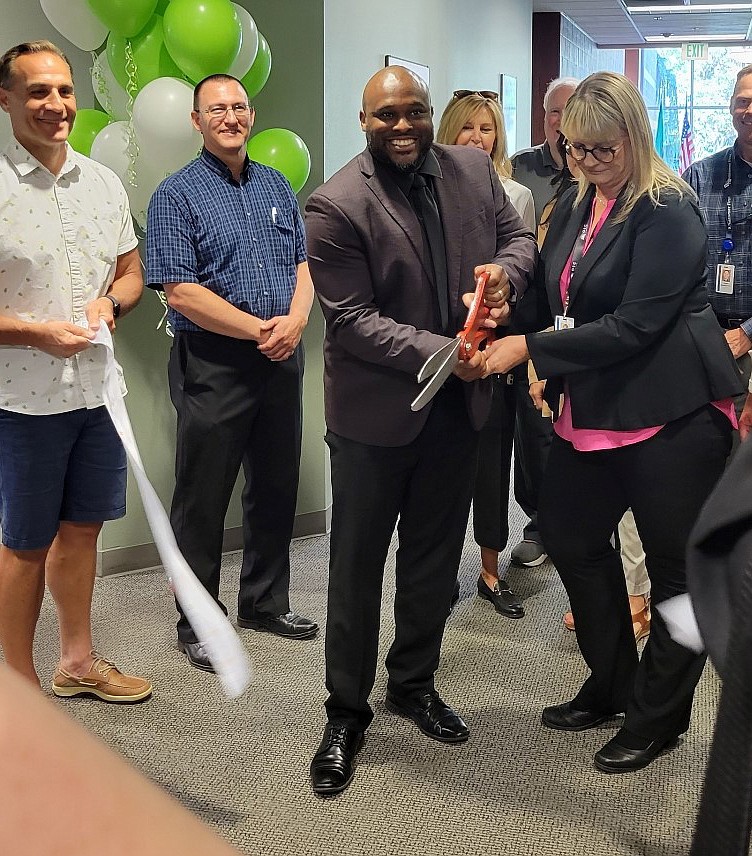 Opportunities Industrialization Center of Washington CEO Anthony Peterson, left, and Supportive Services Director Candi Jaeger cut the ribbon at OIC’s new location in the Worksource Center on East Fifth Avenue in Moses Lake.