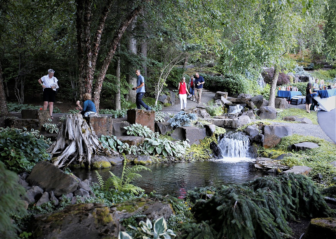 Guests get a look at Hagadone Gardens on Casco Bay during the "Finish the Journey" fundraiser for Companions Animal Center on July 18.