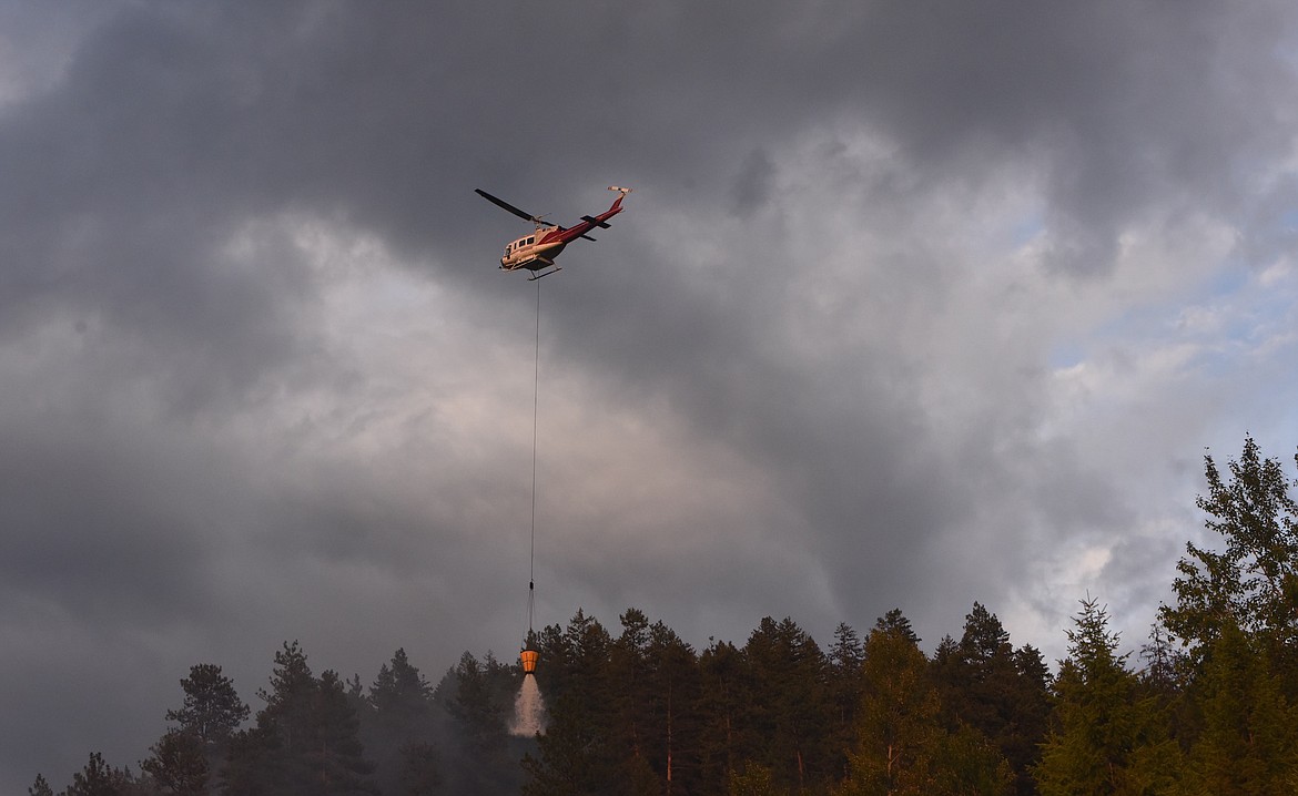 Two helicopters and a plane aided firefighters who responded to two wildfires located just off Jennings Haul Road near Libby earlier this month. (Scott Shindledecker/The Western News)